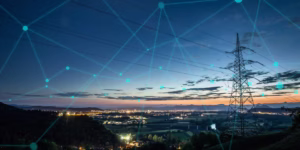 High power electricity pylon above a city skyline